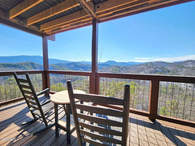 wooden terrace with a mountain view