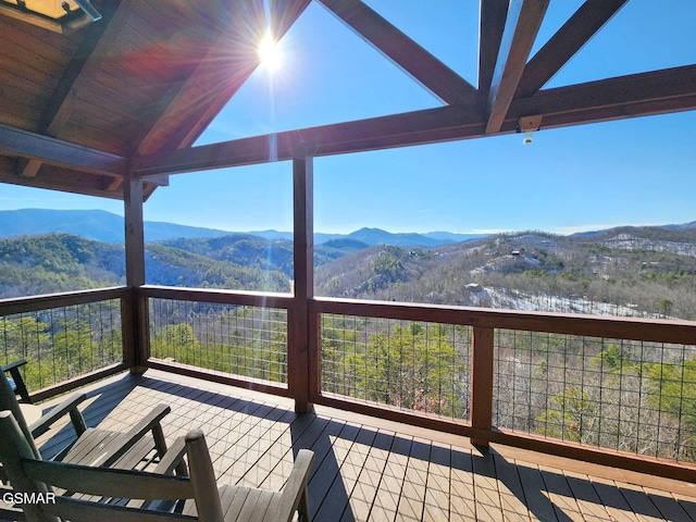 wooden terrace with a mountain view