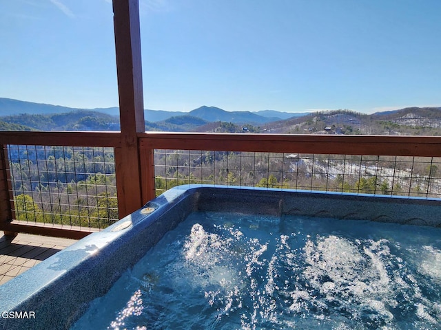 view of swimming pool with a mountain view