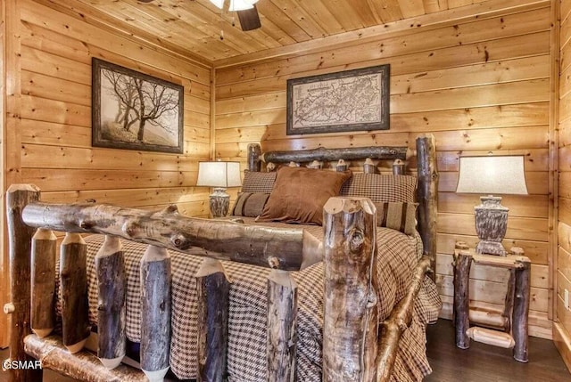 bedroom with wooden ceiling, dark hardwood / wood-style floors, and ceiling fan