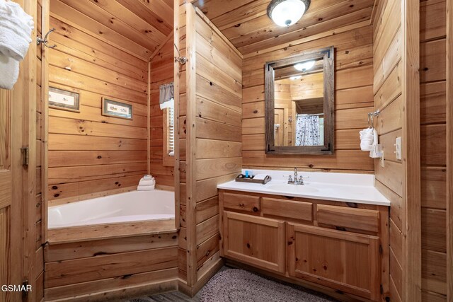 full bath featuring wooden ceiling, vanity, a bathing tub, and wood walls