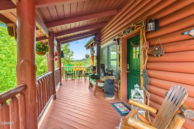 wooden terrace with a porch