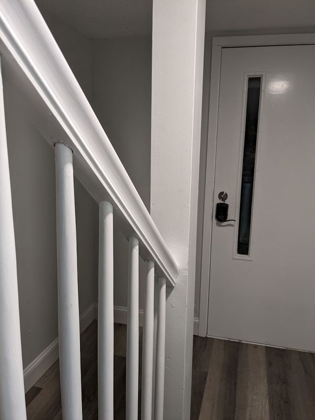 stairway with wood-type flooring