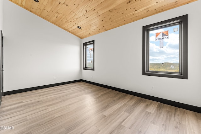1409 Reedmont Way, Sevierville, TN 37876 - spare room featuring vaulted ceiling, wood ceiling, and light wood-style flooring