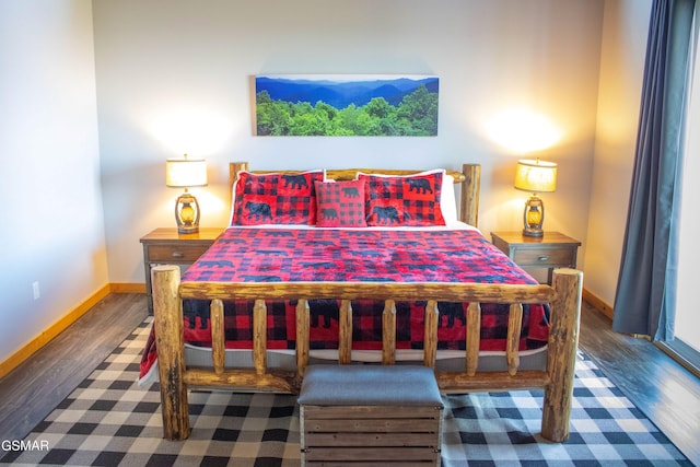 bedroom with dark wood-type flooring