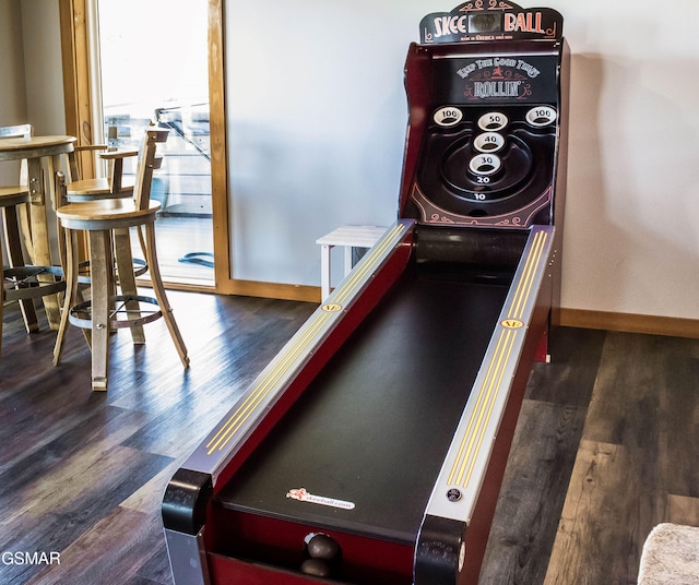 game room featuring dark wood-type flooring