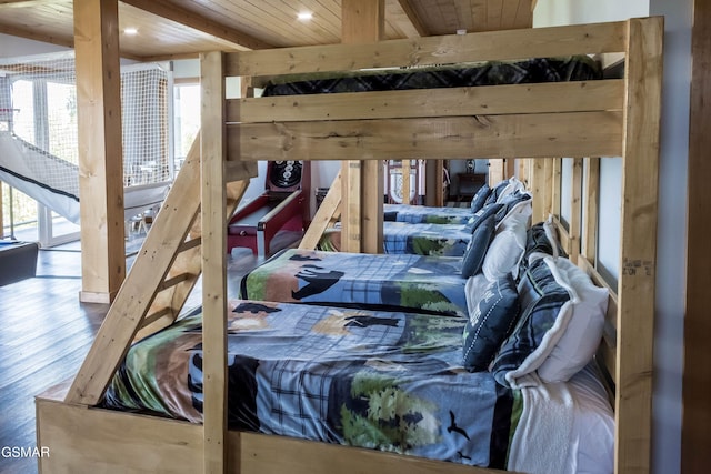 bedroom with hardwood / wood-style floors and wooden ceiling