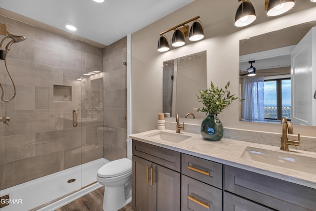 1505 Misty Ct, Sevierville, TN 37862 - bathroom with double vanity, a stall shower, wood finished floors, and recessed lighting