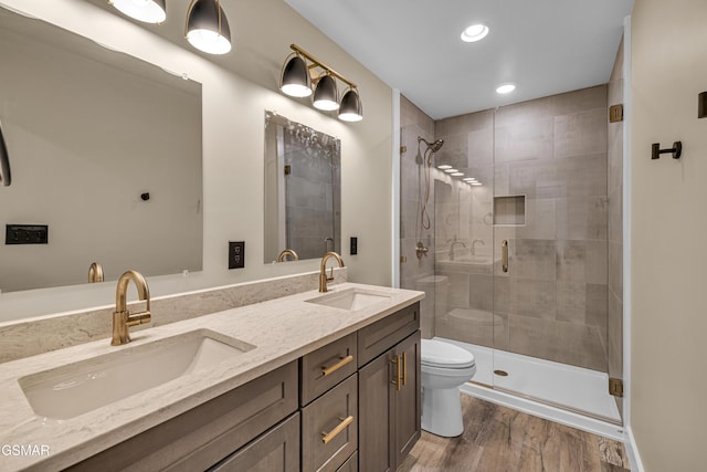 1505 Misty Ct, Sevierville, TN 37862 - full bath featuring a stall shower, double vanity, wood finished floors, and recessed lighting