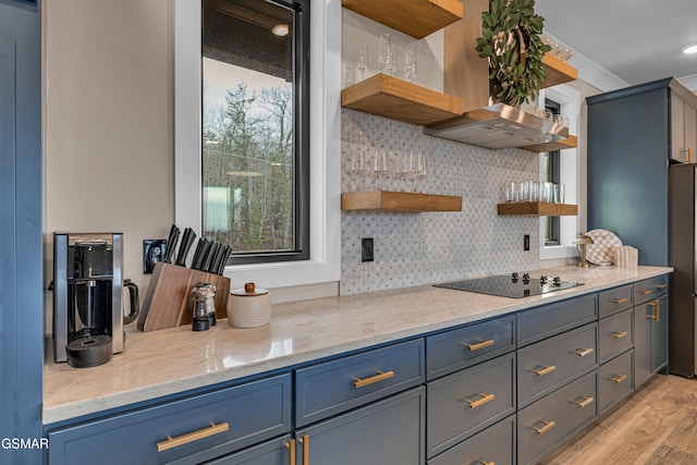 1505 Misty Ct, Sevierville, TN 37862 - kitchen featuring open shelves, black electric stovetop, light wood-style flooring, and light stone counters