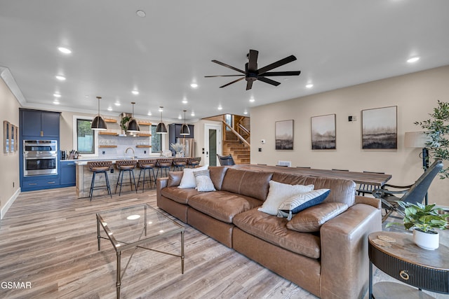 1505 Misty Ct, Sevierville, TN 37862 - living room featuring light wood-type flooring, stairway, recessed lighting, and a ceiling fan