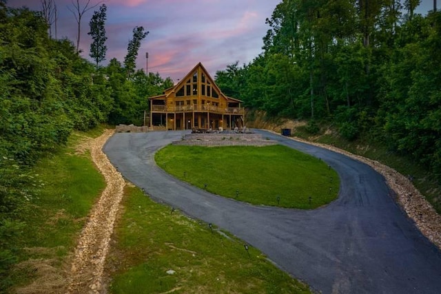 view of home's community featuring a yard and a deck