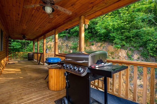 deck with grilling area and ceiling fan