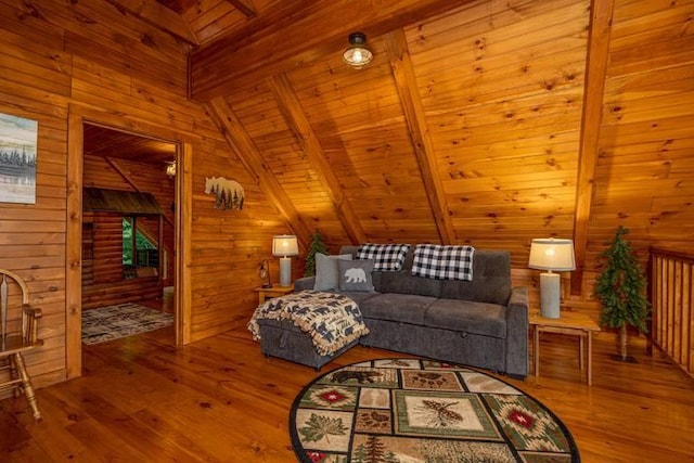 living room with vaulted ceiling with beams, wooden walls, hardwood / wood-style floors, and wood ceiling