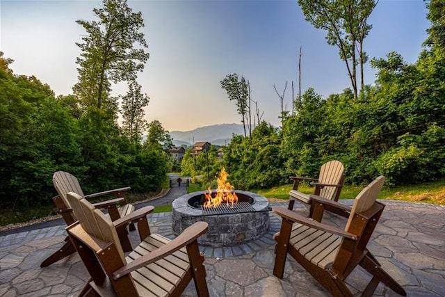 patio terrace at dusk with an outdoor fire pit