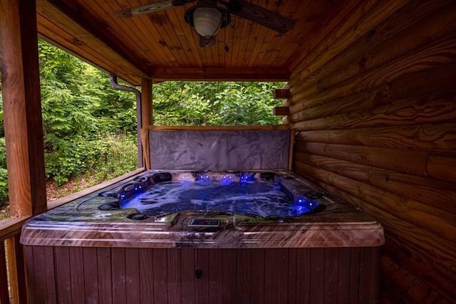 exterior space with a hot tub