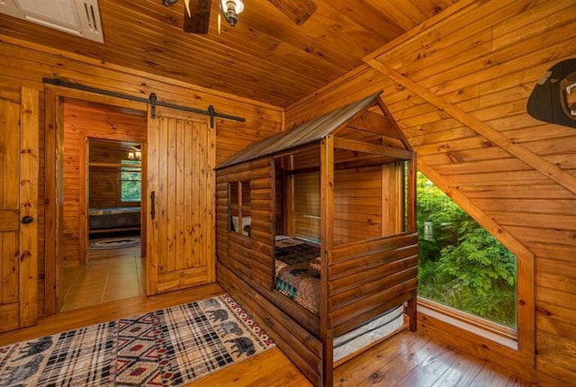 hallway featuring light hardwood / wood-style floors and log walls