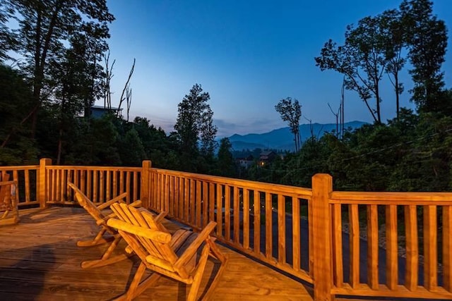 deck at dusk with a mountain view