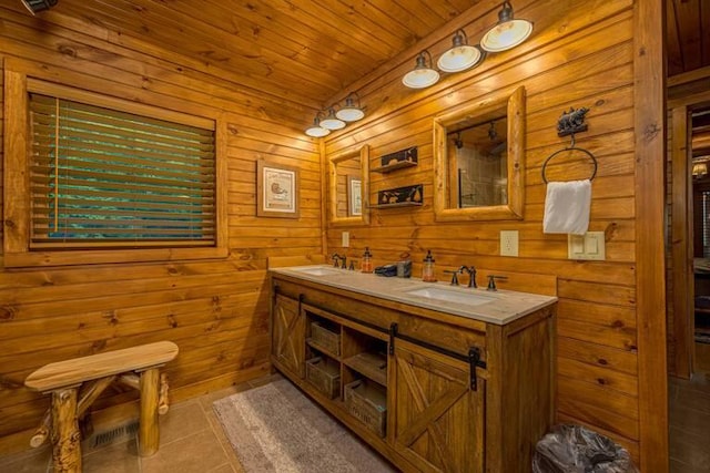 bathroom featuring tile patterned floors, vanity, wood ceiling, and wooden walls