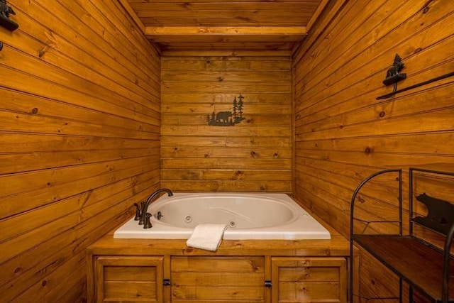 bathroom featuring wood walls and a tub to relax in