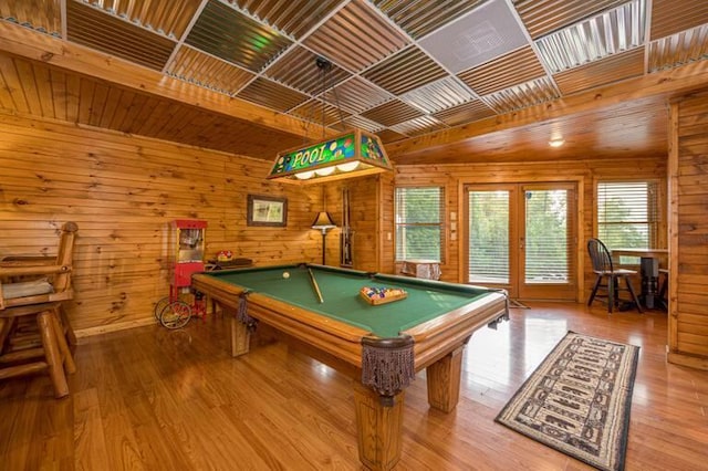 recreation room featuring wooden walls, hardwood / wood-style floors, and billiards