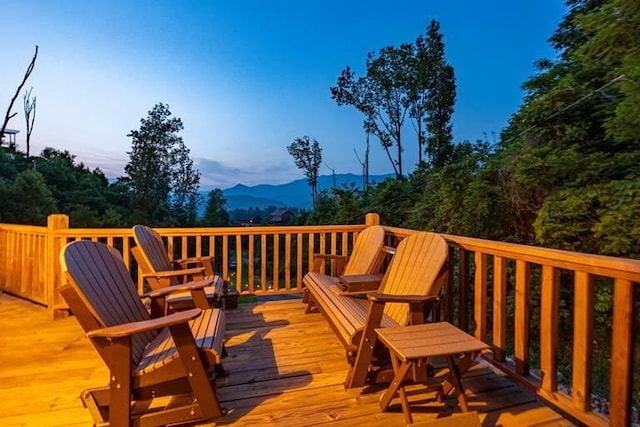 wooden terrace featuring a mountain view