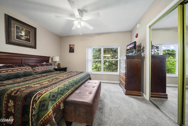205 Ogle Dr Unit 614, Pigeon Forge, TN 37863 - carpeted bedroom featuring a textured ceiling, baseboards, and a ceiling fan