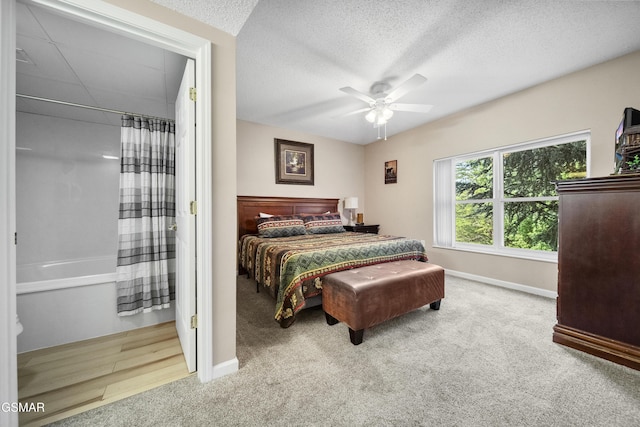 205 Ogle Dr Unit 614, Pigeon Forge, TN 37863 - carpeted bedroom featuring baseboards, a textured ceiling, and ceiling fan