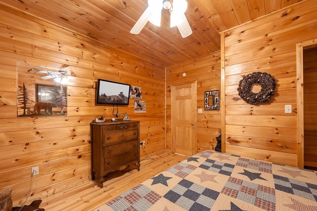 bedroom featuring light wood-type flooring and wooden ceiling