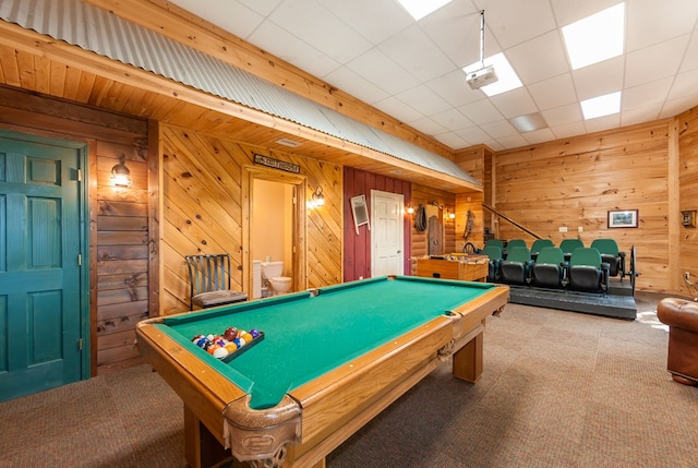 playroom with carpet, billiards, and wood walls