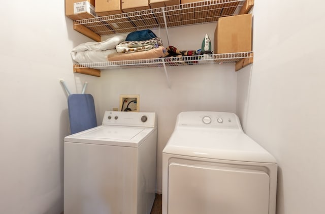 washroom featuring laundry area and washing machine and clothes dryer