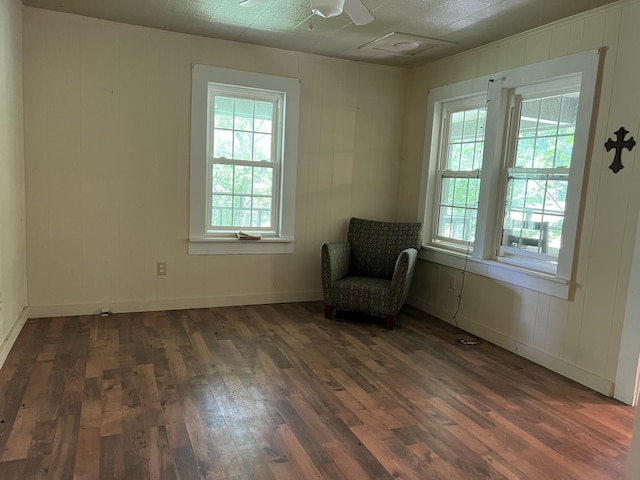 unfurnished room featuring dark hardwood / wood-style flooring and ceiling fan