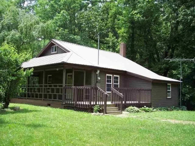 exterior space featuring a front yard and a deck