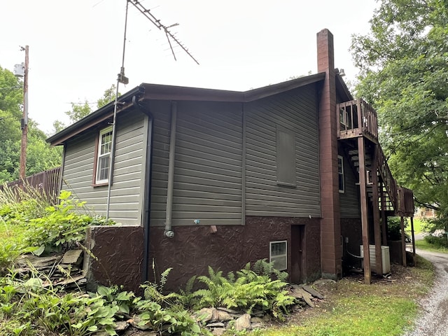 view of property exterior with cooling unit