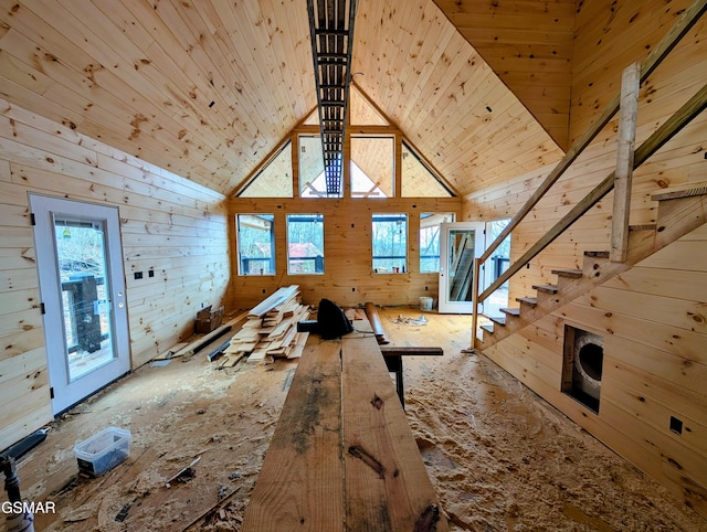 interior space with wood walls, wooden ceiling, and a wealth of natural light