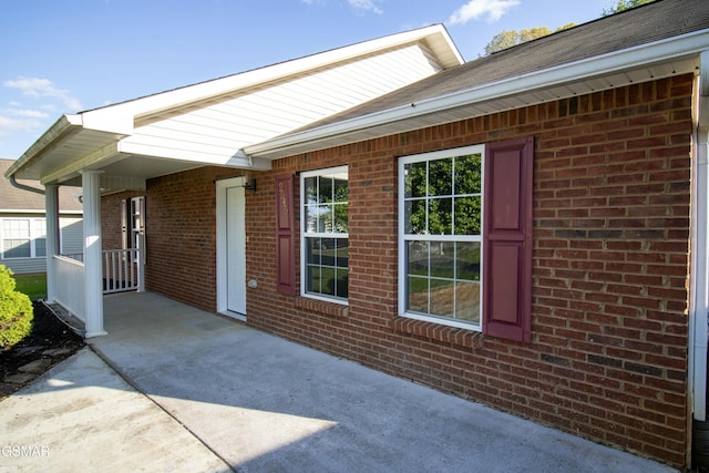 exterior space featuring brick siding