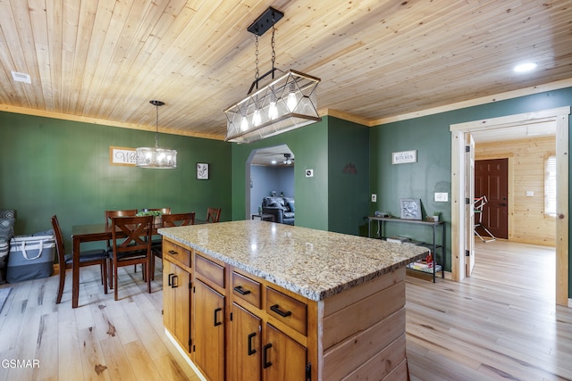 4323 Boogertown Rd, Sevierville, TN 37876 - kitchen with light wood-style flooring, wooden ceiling, ornamental molding, hanging light fixtures, and a kitchen island