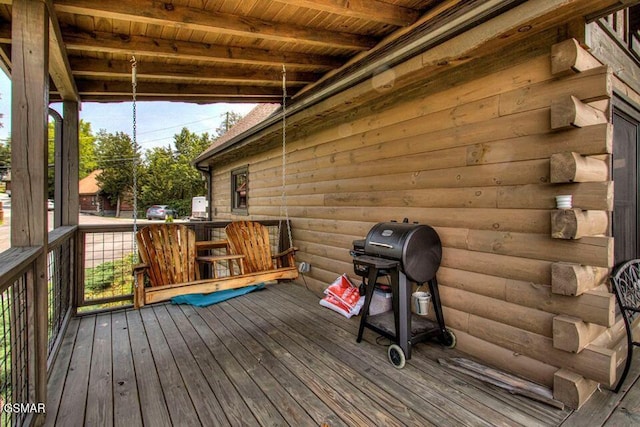 wooden terrace featuring area for grilling