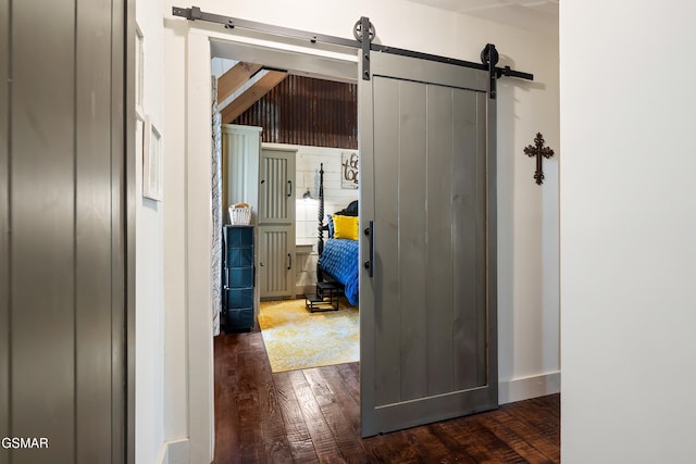 4115 Mae Ln, Sevierville, TN 37862 - corridor featuring dark wood-type flooring, a barn door, and baseboards