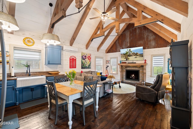 4115 Mae Ln, Sevierville, TN 37862 - dining space featuring a warm lit fireplace, wooden walls, beamed ceiling, a wall unit AC, and dark wood-style floors