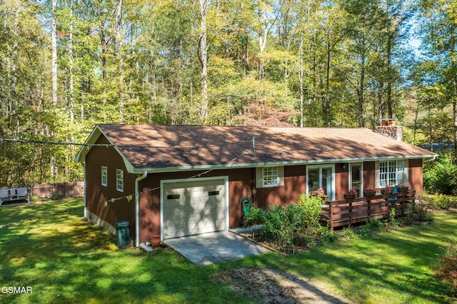 view of front of property featuring driveway, a garage, a chimney, roof with shingles, and a front lawn