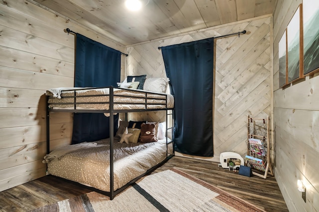 bedroom featuring hardwood / wood-style flooring, wood walls, and wood ceiling