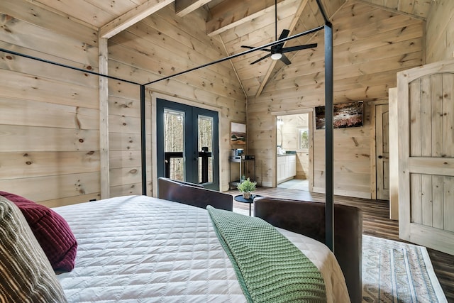 bedroom with wood ceiling, french doors, beam ceiling, wood walls, and connected bathroom