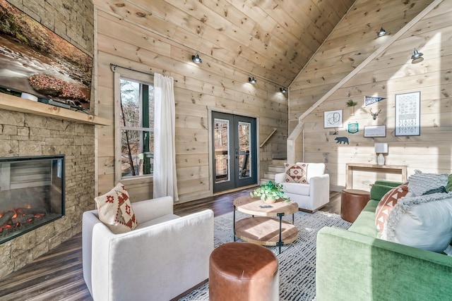 living room with french doors, dark hardwood / wood-style flooring, a fireplace, wooden ceiling, and lofted ceiling