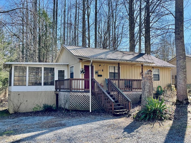4955 Ledford Rd, Cosby, TN 37722 - view of front of property featuring a sunroom, metal roof, and stairs