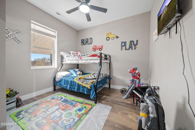 bedroom featuring hardwood / wood-style flooring and ceiling fan