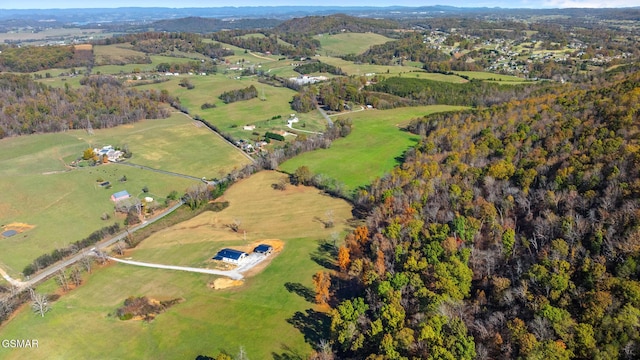 birds eye view of property with a rural view