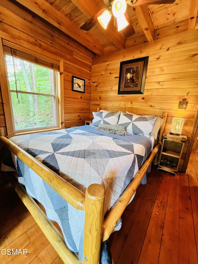 2527 Raccoon Hollow Way, Sevierville, TN 37862 - bedroom featuring a wooden ceiling with exposed beams, hardwood / wood-style flooring, and wooden walls