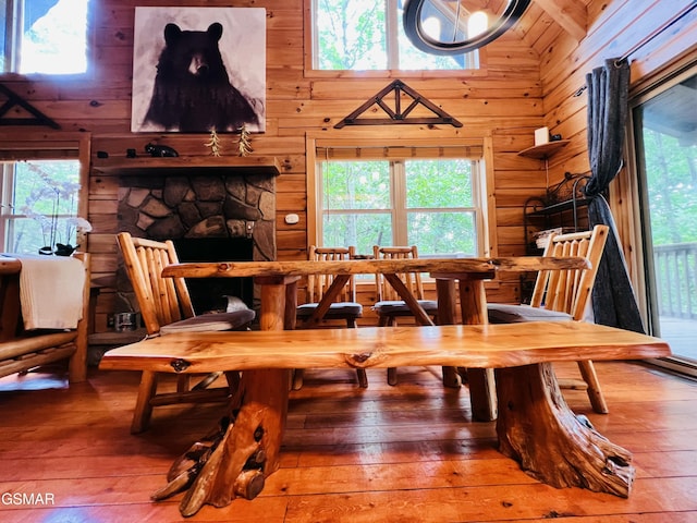 2527 Raccoon Hollow Way, Sevierville, TN 37862 - dining area with wooden walls, hardwood / wood-style floors, and healthy amount of natural light