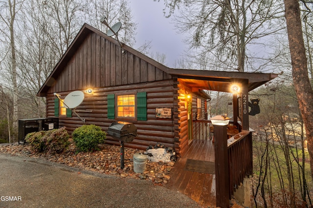 2210 Hawks Point Way, Sevierville, TN 37862 - log cabin with board and batten siding, log siding, and a deck